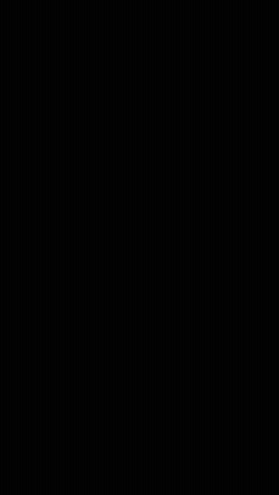 A Man Is Riding A Dirt Bike Down A Dirt Road GIF