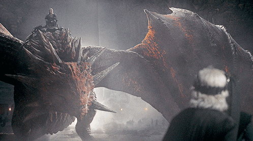 A Man Is Riding A Dragon In A Dark Room GIF