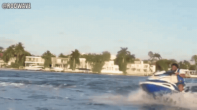 A Man Is Riding A Jet Ski In The Ocean With The Hashtag Rodwave GIF