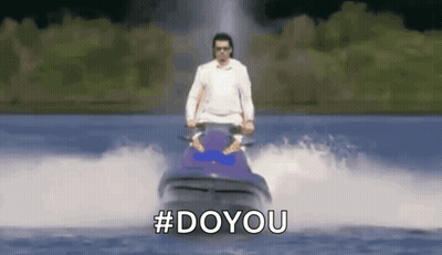 A Man Is Riding A Jet Ski In The Water With The Hashtag #Doyou . GIF