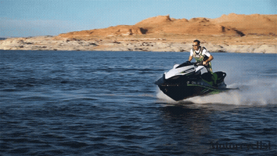 A Man Is Riding A Jet Ski On A Lake With Mountains In The Background And A License Plate That Says O Chl GIF