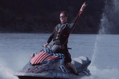A Man Is Riding A Jet Ski With A License Plate That Says Cf 3812 Rn975 GIF