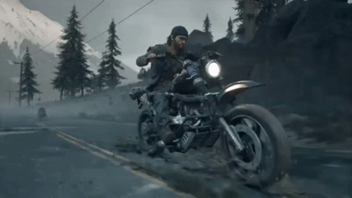 A Man Is Riding A Motorcycle Down A Road With Mountains In The Background And A License Plate That Says ' A ' GIF