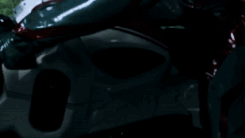 A Man Is Riding A Motorcycle With Sparks Coming Out Of The Wheel GIF