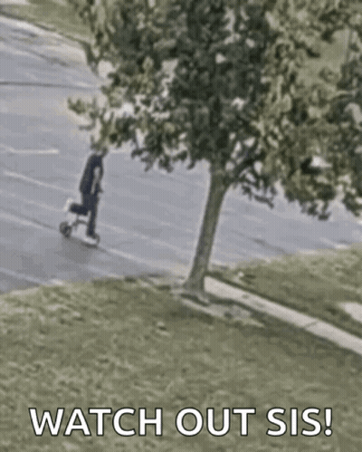 A Man Is Riding A Scooter Down A Street With The Words `` Watch Out Sis '' Written On The Bottom . GIF
