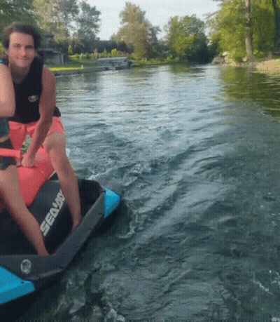 A Man Is Riding A Sea Doo Jet Ski In The Water GIF