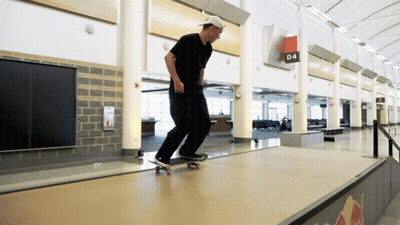 A Man Is Riding A Skateboard On A Ramp With A Sign That Says D4 On It GIF