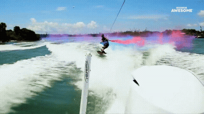 A Man Is Riding A Surfboard In The Water And The Words Awesome Are On The Bottom GIF