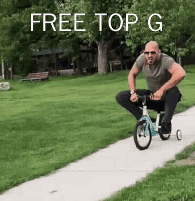A Man Is Riding A Tricycle On A Sidewalk With The Words Free Top G Written Above Him GIF