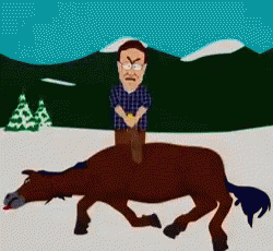 A Man Is Riding On The Back Of A Dead Horse GIF