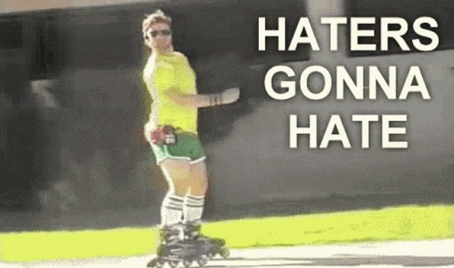 A Man Is Rollerblading On A Sidewalk With The Words `` Haters Gonna Hate '' Written On The Bottom . GIF