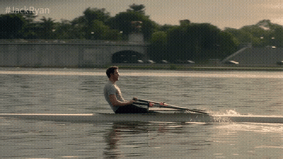A Man Is Rowing A Boat On A Lake With #Jackryan Written Above Him GIF