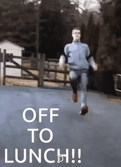 A Man Is Running Down A Road With The Words Off To Lunch GIF