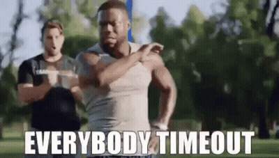 A Man Is Running In A Park With The Words `` Everybody Timeout '' Written On It . GIF