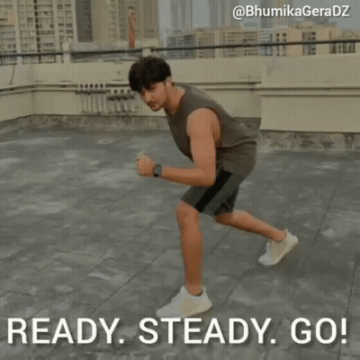 A Man Is Running On A Rooftop With The Words Ready Steady Go Behind Him GIF