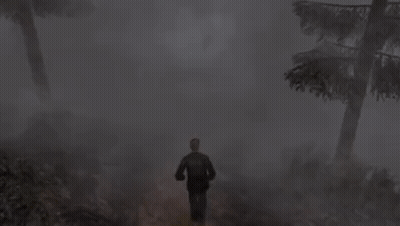 A Man Is Running Through A Foggy Forest With Trees . GIF