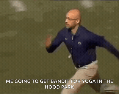 A Man Is Running To Get Bandit For Yoga In The Hood Park GIF