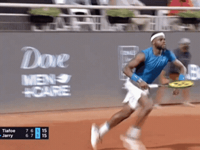 A Man Is Running With A Tennis Racquet In Front Of A Dove Men Care Ad GIF