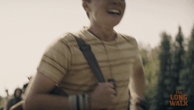 A Man Is Running With The Long Walk Written On The Bottom Of The Image GIF