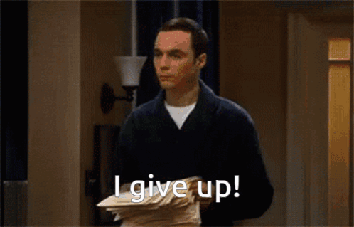 A Man Is Saying I Give Up While Holding A Piece Of Paper GIF