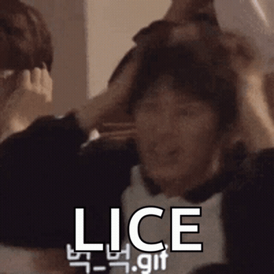 A Man Is Scratching His Head With His Hands And The Word Lice Is On The Bottom Of The Image . GIF