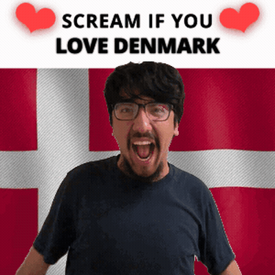 A Man Is Screaming In Front Of A Denmark Flag GIF