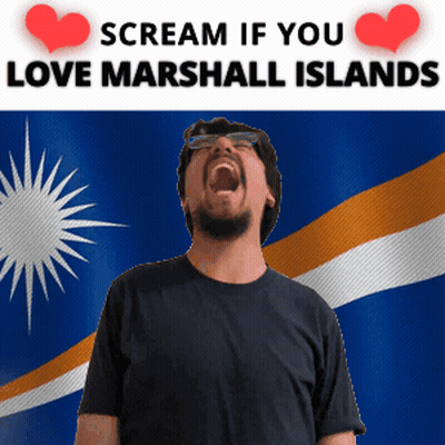 A Man Is Screaming In Front Of A Marshall Island Flag GIF