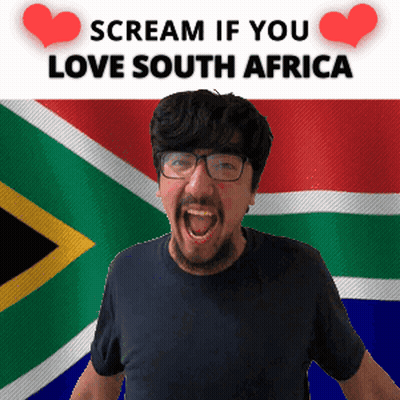 A Man Is Screaming In Front Of A South African Flag GIF