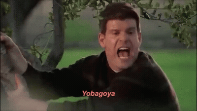 A Man Is Screaming In Front Of A Tree And The Word Yobagoya Is On The Bottom Of His Face . GIF