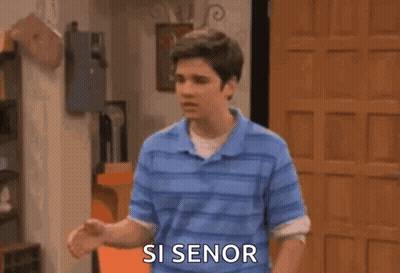 A Man Is Screaming With His Arms In The Air And The Words `` Si Senor '' Written On The Screen . GIF