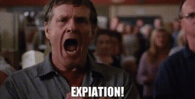 A Man Is Screaming With His Mouth Open In Front Of A Crowd And The Word Expiration Is Written On The Screen . GIF