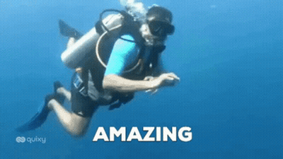 A Man Is Scuba Diving In The Ocean And The Word Amazing Is On The Bottom Of The Picture . GIF
