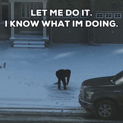 A Man Is Shoveling Snow In Front Of A House With The Words " Let Me Do It I Know What Im Doing " GIF
