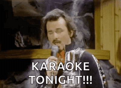 A Man Is Singing Into A Microphone And Saying `` Karaoke Tonight !!! '' . GIF