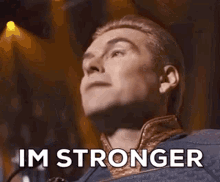 A Man Is Singing Into A Microphone With His Eyes Closed And The Words `` Im Better '' Written On His Face . GIF