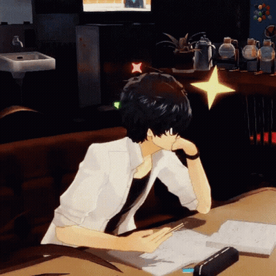 A Man Is Sitting At A Desk With A Book And A Star On His Head GIF