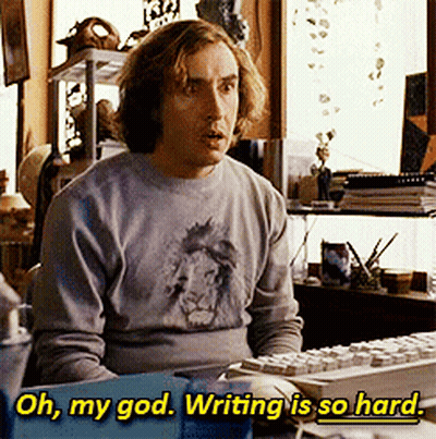 A Man Is Sitting At A Desk With A Keyboard And The Words Oh My God Writing Is So Hard Above Him GIF