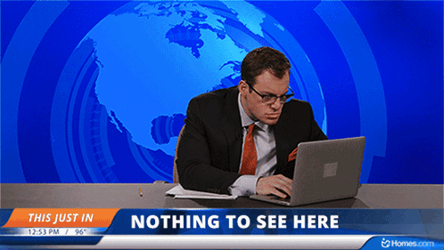 A Man Is Sitting At A Desk With A Laptop In Front Of A Nothing To See Here Banner GIF