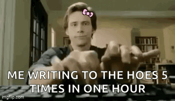 Man Sitting At Keyboard With Pink Bow GIF