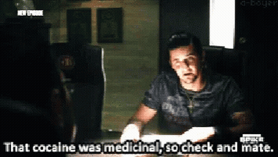 A Man Is Sitting At A Table And Says " That Cocaine Was Medicine " GIF