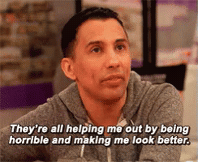 A Man Is Sitting At A Table And Says They 'Re All Helping Me Out By Being Horrible GIF