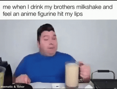 A Man Is Sitting At A Table Drinking A Milkshake And Eating . GIF