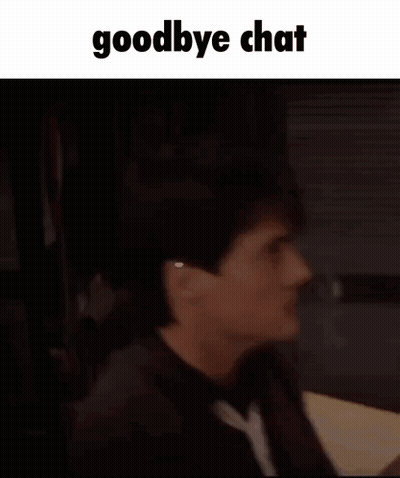 A Man Is Sitting At A Table Talking Into A Microphone With The Words Goodbye Chat Written Above Him . GIF