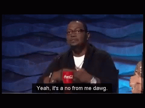 A Man Is Sitting At A Table With A Coca Cola Cup In Front Of Him . GIF