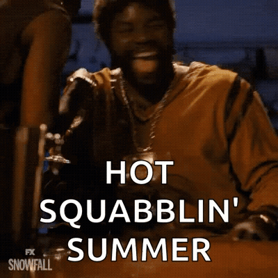 A Man Is Sitting At A Table With A Glass Of Beer In His Hand And Says Hot Squabblin ' Summer . GIF