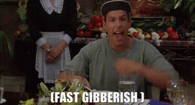 A Man Is Sitting At A Table With A Glass Of Water And A Plate Of Food And Says `` Fast Gibberish '' . GIF