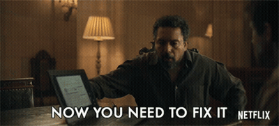 A Man Is Sitting At A Table With A Laptop And The Words Now You Need To Fix It Netflix GIF