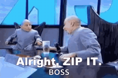 A Man Is Sitting At A Table With A Microphone In His Hand And Says `` Alright , Zip It . Boss '' . GIF