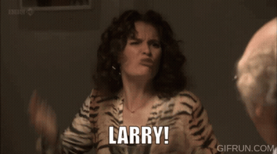 A Man Is Sitting At A Table With A Plate Of Food And A Glass Of Wine While A Woman Says What GIF