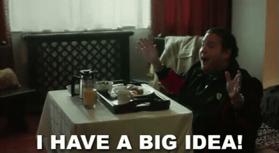 A Man Is Sitting At A Table With A Tray Of Food And The Words I Have A Big Idea GIF
